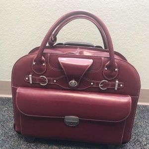 Beautiful red leather bag with rolling ability